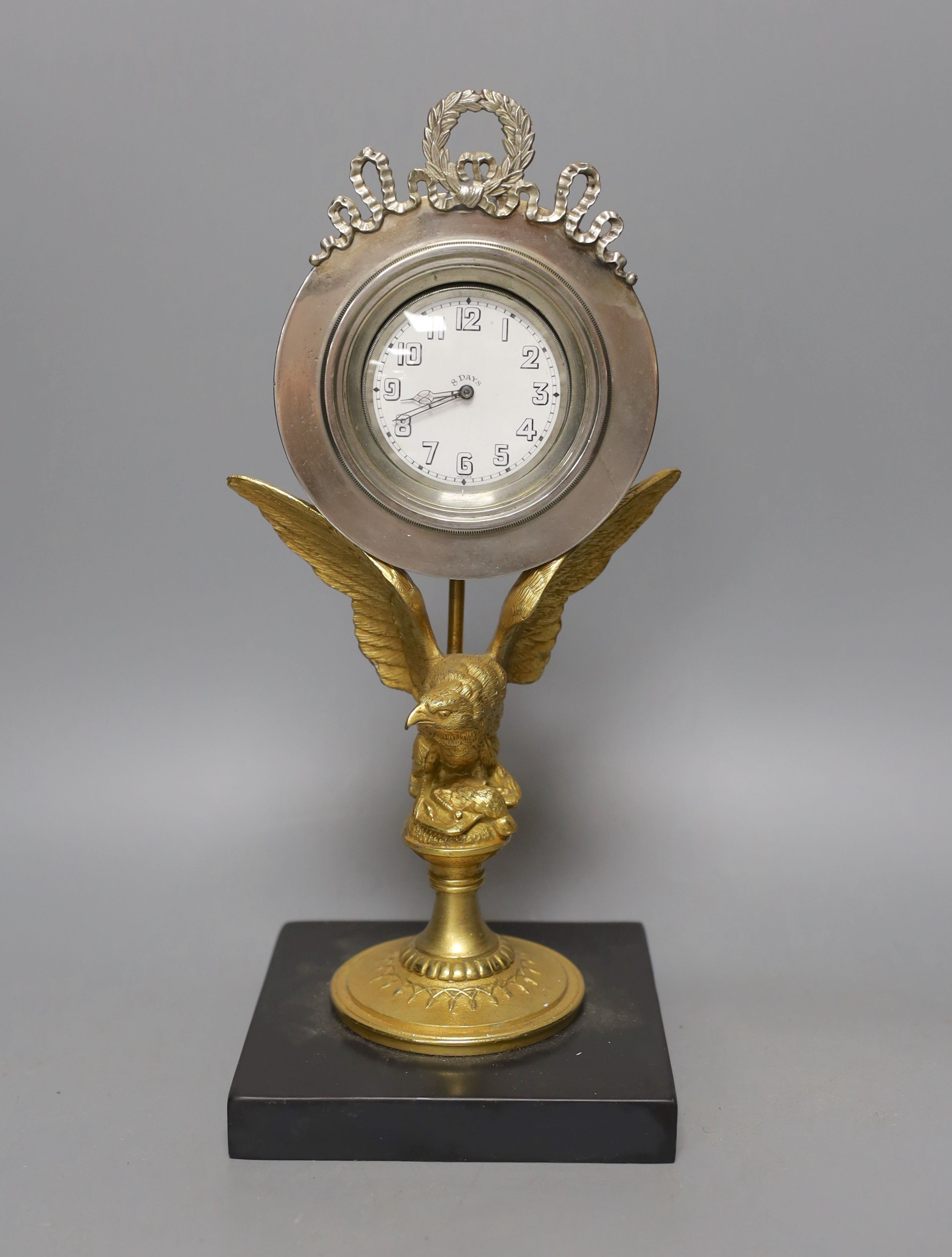 A gilt metal 8 day ‘eagle’ desk timepiece with marble slab base 30cm